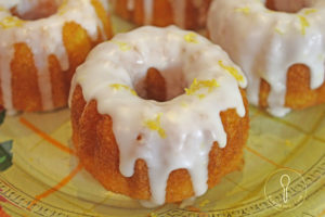 lemon bundt cake with glaze and lemon peel